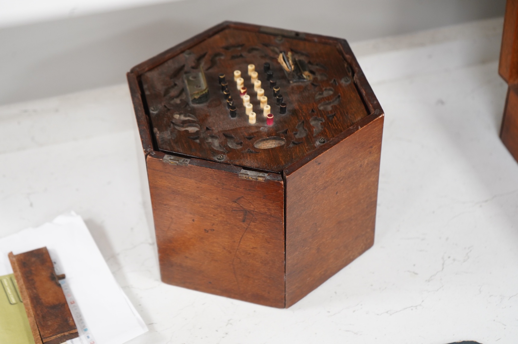 A Wheatstone mahogany cased 48 key rosewood and leather and paper bellows concertina, 18cm wide